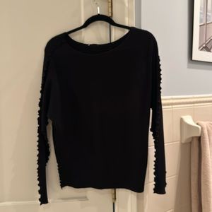 Pretty black sweater with buttons down the back and scalloped details